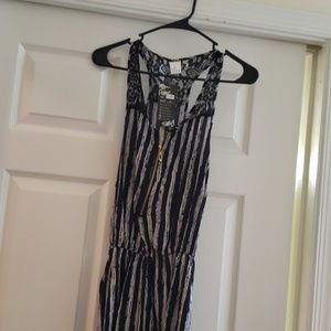 Navy blue/white romper. Back detailing is black